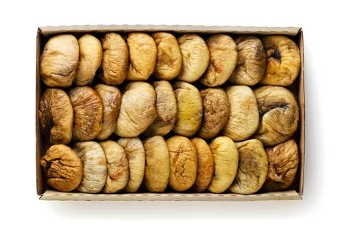 Dried dates in a paper box on a white. Top view Stock Photos