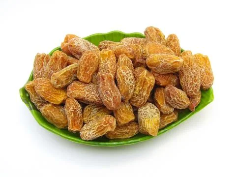 Dried dates in a plate on white background  Stock-Fotos