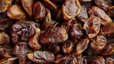 Dried dates rotating. Organic ingredient for cooking. Top view. Pile of dates. Video stock 290313553