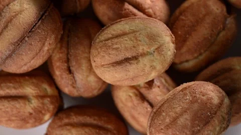 Dried Dates Spinning on Dark Surface. Top-Down Seamless Motion Loop Stock Footage 325529398