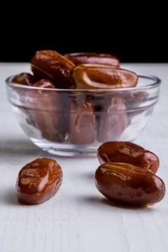 Dried dates on white table Stock Photos