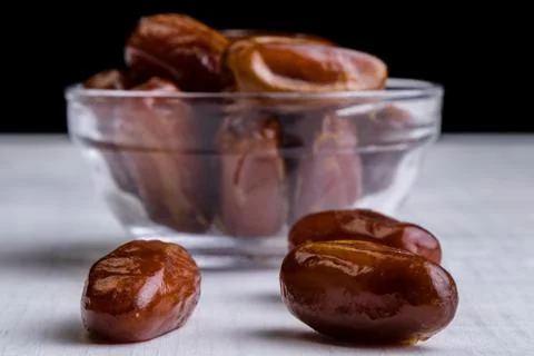 Dried dates on white table Stock Photos