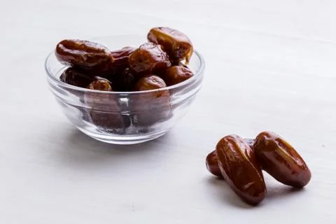 Dried dates on white table Stock Photos