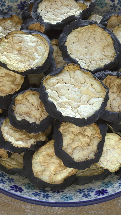 Dried eggplant slices. Table spin. Vertical video. Stock Footage 277935757