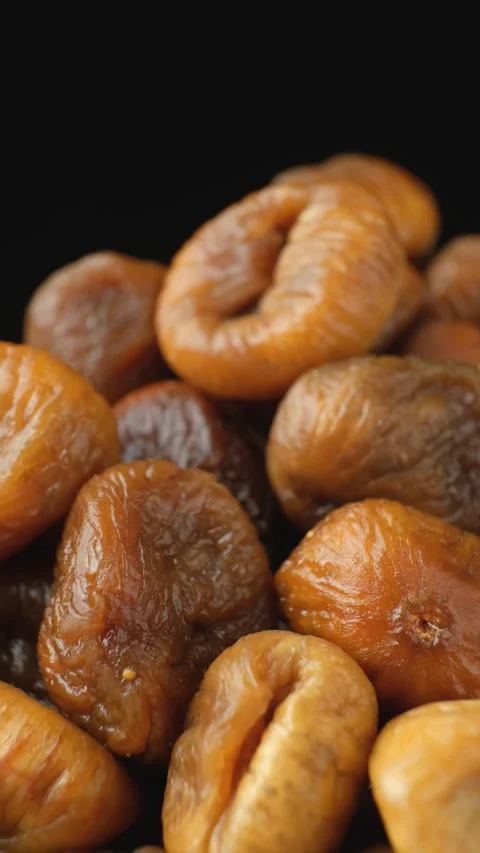 Dried Fig Fruit Rotate Vertical on Black Background Stock Footage 329886717
