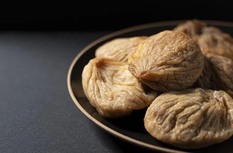 Dried figs on a black background Stock Photos