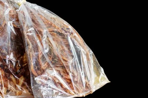 Dried fish with black background. Stock Photos