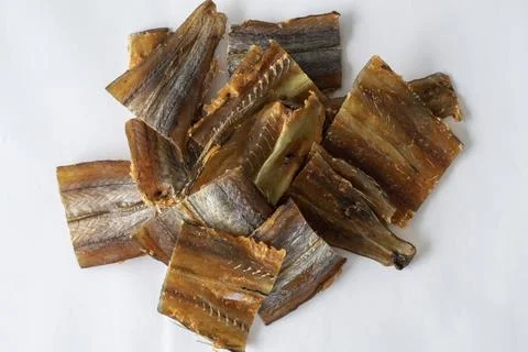 Dried fish fillet red cod amber. An snack for beer on a white background. Stock Photos