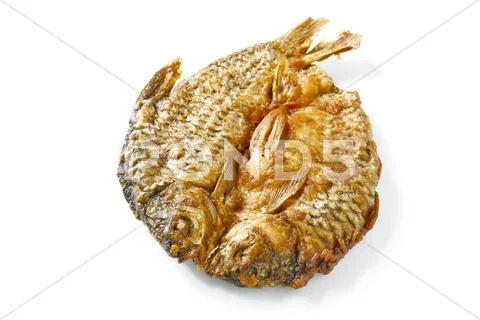 Dried fish fried on white. Stock Photos