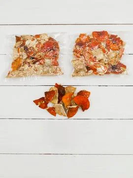 Dried fly agaric in a transparent package on a white background. Stock Photos