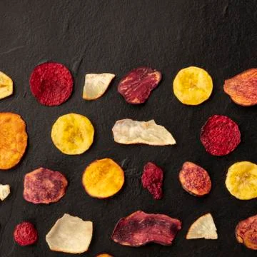 Dried fruit and vegetable chips, square overhead shot with a place for text Foto stock