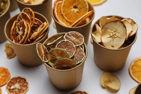 Dried fruit on colored background. Pattern of a fruit frips. Healthy eating Stockfoto's