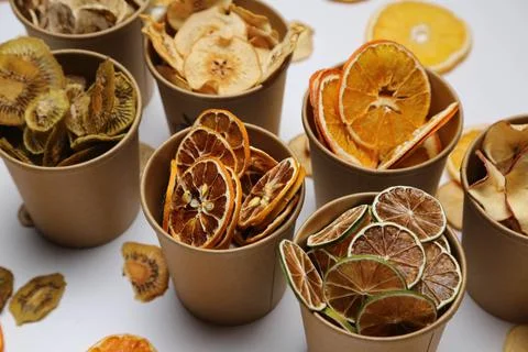 Dried fruit on colored background. Pattern of a fruit frips. Healthy eating Stockfoto's