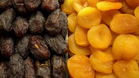 Dried fruit dates and dried apricots Stock Footage 122494361