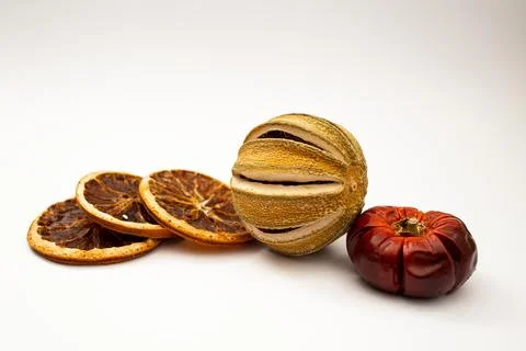 Dried fruit, fruit and cinnamon on white background Stock Photos