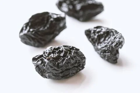 Dried fruit prune on white background . Stock Photos