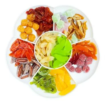 Dried fruit in sectioned plate, top view, isolated Stock Photos