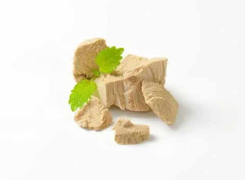 Dried ginger root with fresh leaf on white Stock Photos
