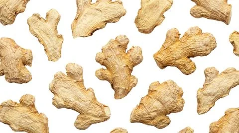 Dried ginger root pieces, scattered on white background, natural ingredient.. Фото