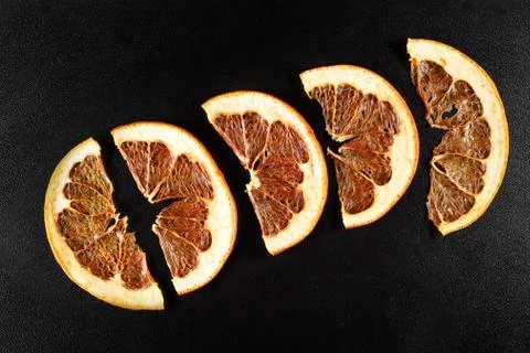 Dried grapefruit on black background Stock Photos