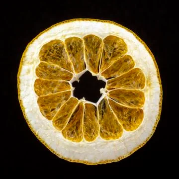 Dried grapefruit slice on a dark background Stock Photos