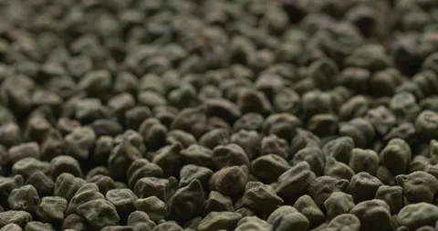 Dried green chickpea background.  Seamless loop. Stock Footage 277609092