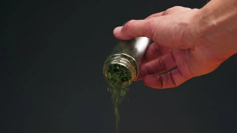 Dried green dill close-up macro. Spice for food. Man hand strewing dill on food Stock Footage 281664175