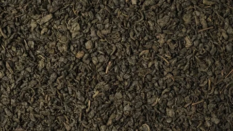 Dried green tea leaves background texture dolly shot Stock Footage 342437590