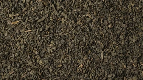 Dried green tea leaves rotating background Stock Footage 341281095
