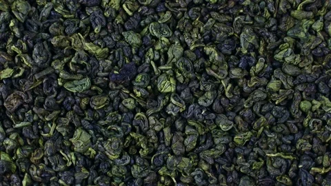 Dried green tea leaves texture rotation ... | Stock Video | Pond5