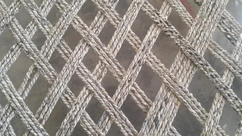 Dried jute thread or ropes interwoven for making traditional bed called charp Stock Photos