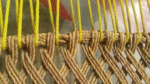 Dried jute thread or ropes interwoven for making traditional bed called charp Stock Photos