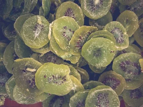 Dried kiwi background sliced into thin slices Stock Photos