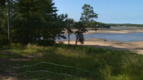 Dried Up Lake through Field Stock Footage 32934960