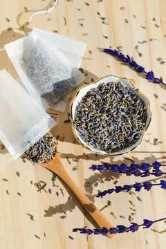 Dried lavender, spoon and tea bag sachet on wooden table. Organic flower herbal Stock Photos