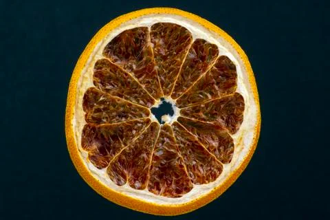 Dried lemon slice on a dark background Stock Photos