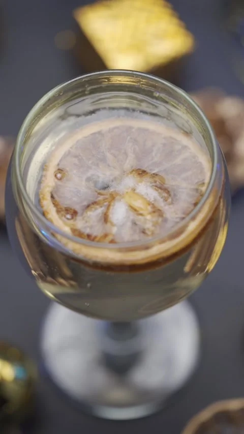 Dried lemon slice inside a glass jar filled with infused water, close up shot Stock Footage 335204874