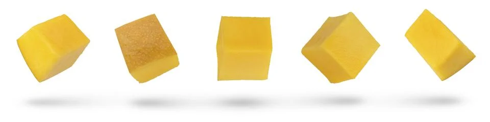 Dried mango cubes on a white isolated background. Mango from different angles Stock Photos