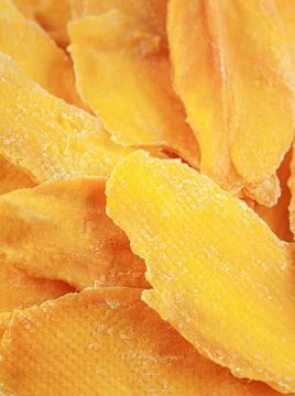 Dried mango slices. Close-up. Macro. Texture. Stock Photos