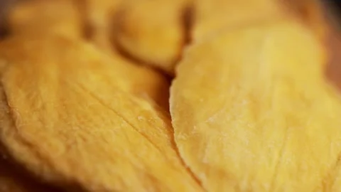 Dried mango slices close-up on a white. Top view. Closeup. Stock Footage 328295104