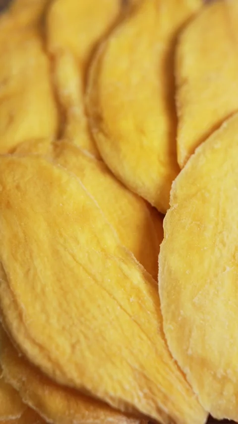 Dried mango slices close-up on a white. Top view. Closeup. Stock Footage 328295105