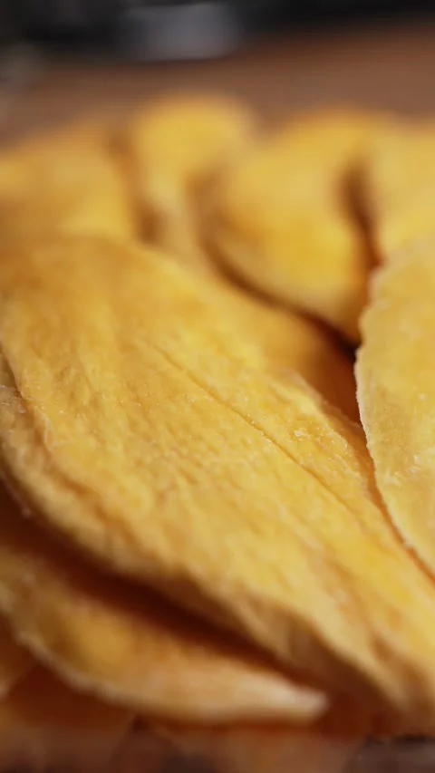 Dried mango slices close-up on a white. Top view. Stock Footage 328295106