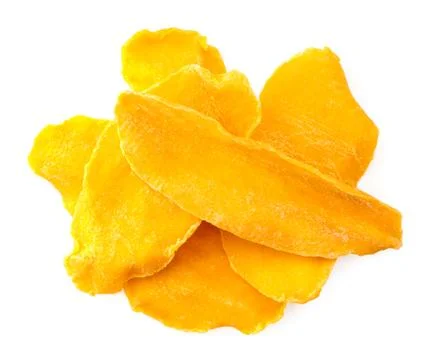 Dried mango slices close-up on a white. Top view Stock Photos