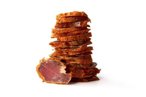 Dried meat beef jerky dry isolated on white background. Stock Photos