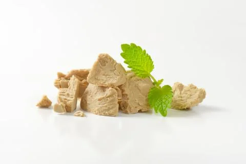 Dried meat chunks with mint leaf Stock Photos