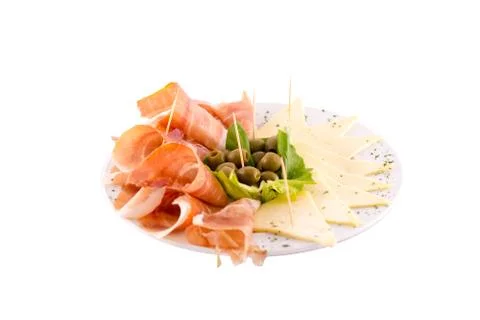 Dried meat (prshut), white cheese and green olives Stock Photos