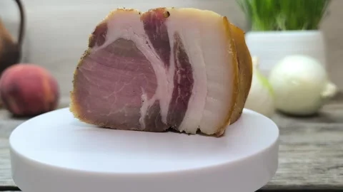 Dried meat on the table surrounded by vegetables and fruits. Stock Footage 291890503