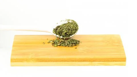 Dried mint on the wooden board isolated on white background. Dried mint concept. Stock Photos