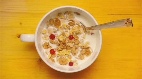 Dried muesli with milk for breakfast. Stop motion, animation Stock-Footage 73960910
