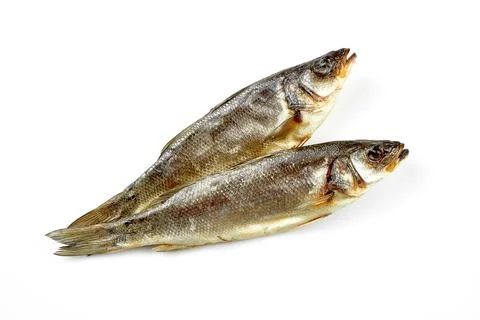 Dried mullet. Close-up, selective focus. White background. Stock Photos
